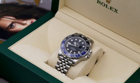 A Rolex BLRN batman shown in the box being presented to the buyer