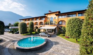 Hotel in Ascona with a blue fountain and entrance