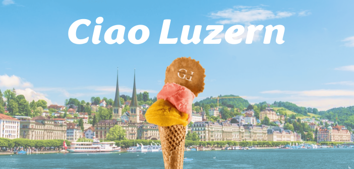 Gelato Lepore Cornetto mit gelber und rosa Kugel auf Hintergrund der Stadt Luzern