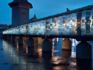 Bridge made of discarded products illuminated in the night