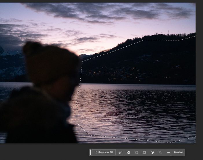 lake sunset black and purple, blurred person in foreground 