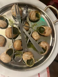 picture of famous paris dish snails with pesto