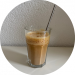 Iced Shakerato in a clear cup with a straw